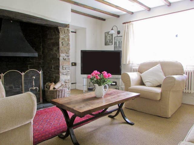 Cosy living room with large open fire | Chaplands, Beaford, near Great Torrington