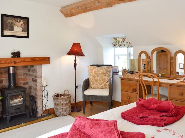 Double bedroom with multi-fuel burner | Woodhouse Cottage, Dobshill, near Chester