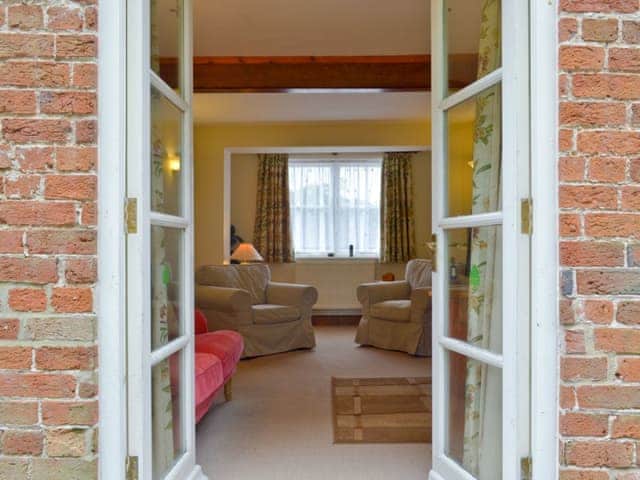 Living room through French doors | Garden Farm Cottage, Ilam, near Ashbourne