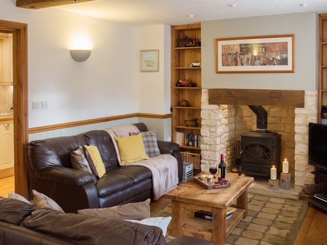 Lovely living room with woodburning sove | Moorhens Cottage, Cotswold Water Parks