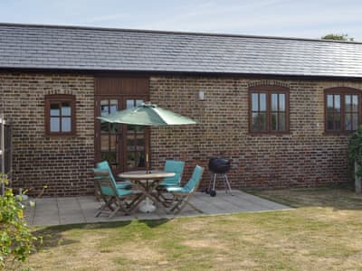 Patio with outdoor furniture | The Haybarn - Decoy Farm Holiday Cottages, High Halstow, near Rochester