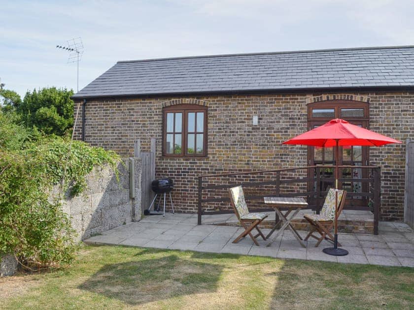 Appealing holiday home with patio and enclosed lawned garden | The Stable - Decoy Farm Holiday Cottages, High Halstow, near Rochester