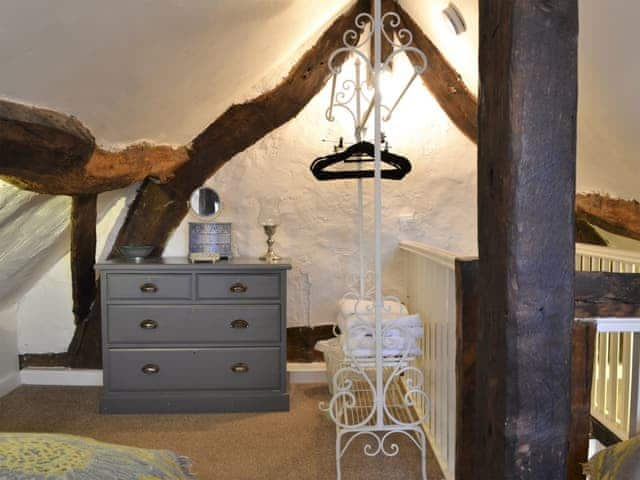 Twin bedroom with beams | Childe of Hale Cottage, Hale Village