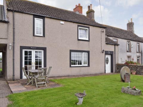 Attractive property with outdoor furniture and lawned garden | Holmlea, Newtown, near Silloth