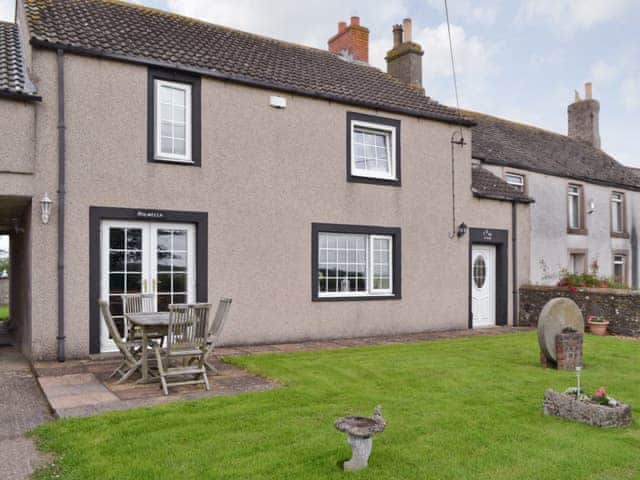 Attractive property with outdoor furniture and lawned garden | Holmlea, Newtown, near Silloth