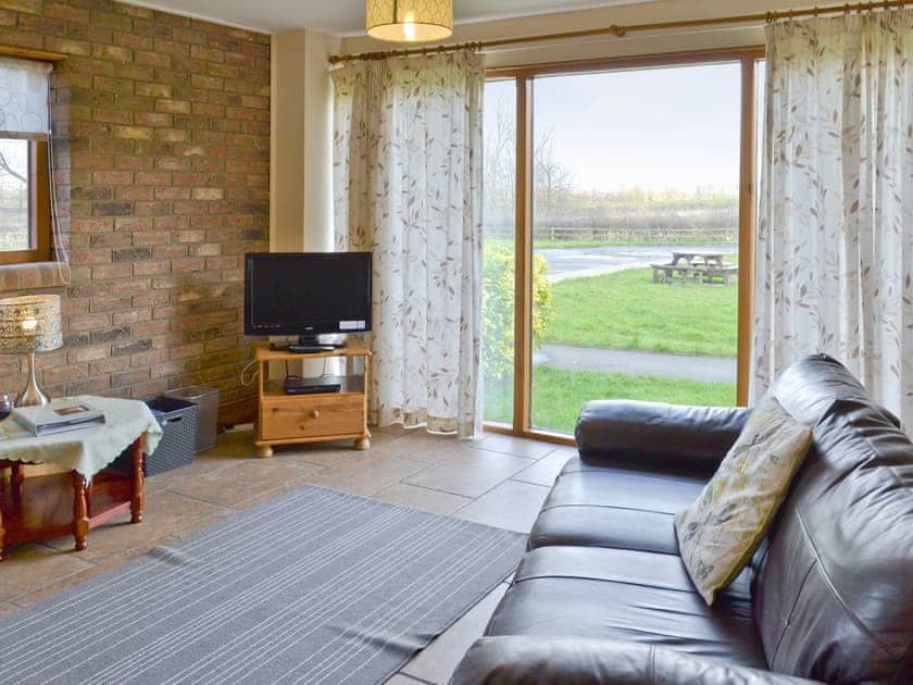 Light and airy living room | Swallow Cottage - Filey Holiday Cottages, Filey