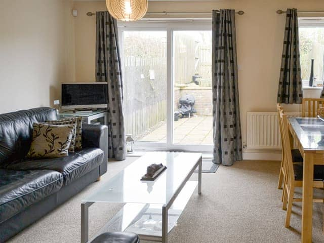 Spacious living and dining room with patio doors | Sea Shore - Tee View and Sea Shore, Seahouses