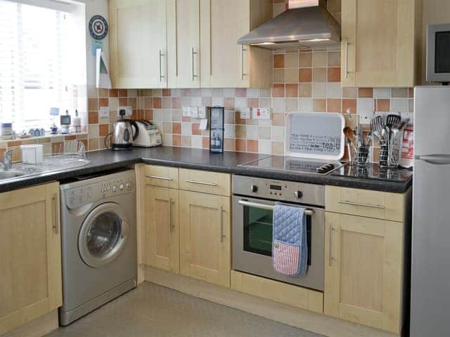 Well-equipped fitted kitchen | Sea Shore - Tee View and Sea Shore, Seahouses