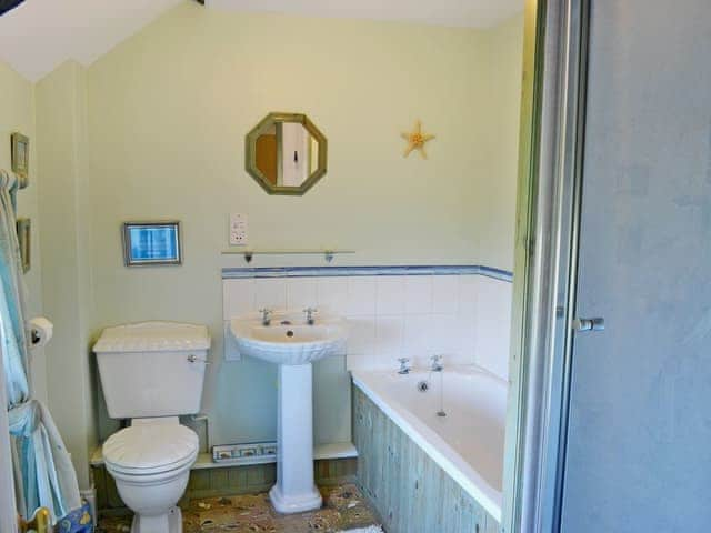 Bathroom with bath, separate shower cubicle, WC and wash basin | Sandsedge Cottage, Druridge Bay