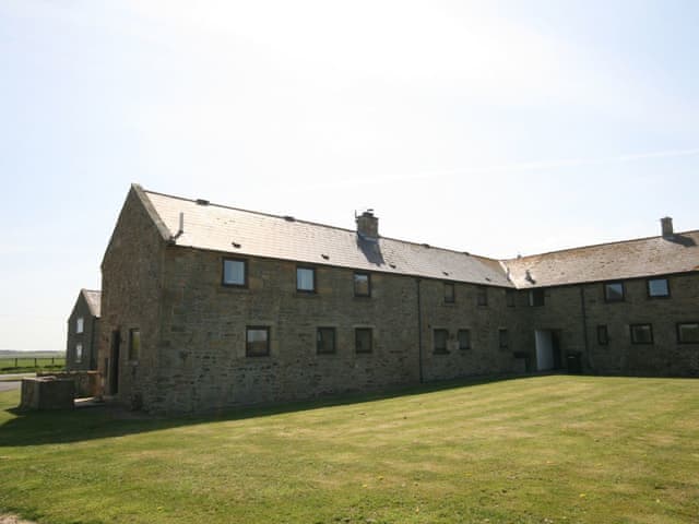 Small cluster of stone cottages | Sandsedge Cottage, Druridge Bay