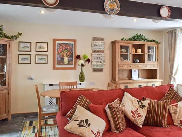 Living room with dining area | River Cottage, Keswick