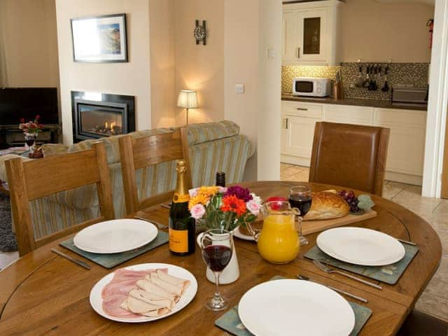 Dining area adjoins lounge and kitchen | Tommy&rsquo;s Cottage, Keswick