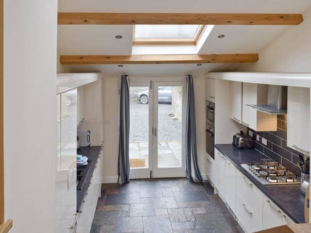 Stylish kitchen with French doors to outdoor area | Falcon Crag, Keswick