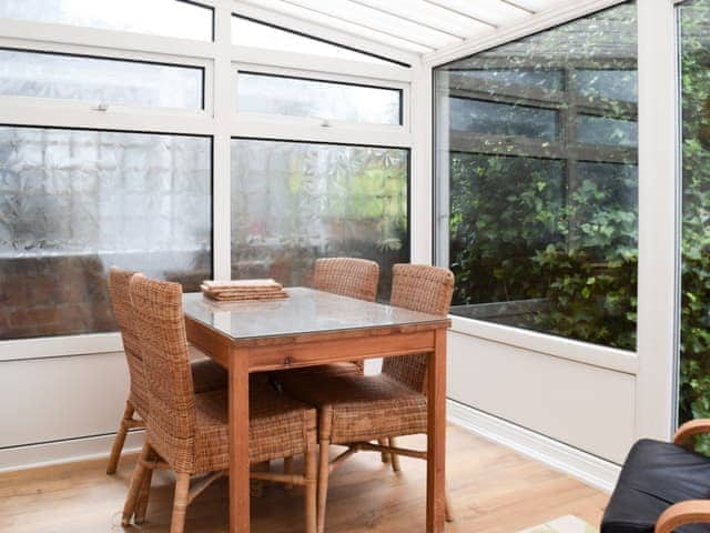 Lovely conservatory with dining table | Valentine Cottage, Keswick