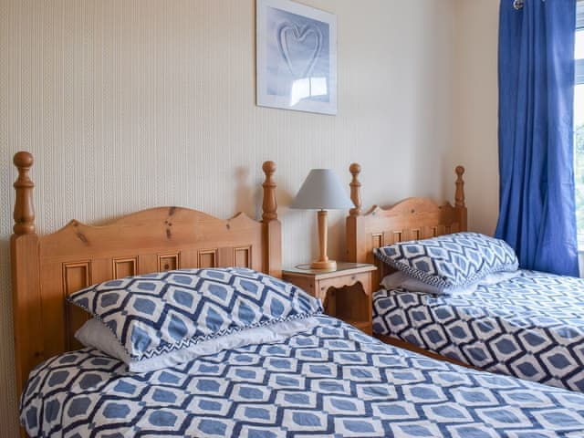 Comfortable and inviting twin bedroom | Valentine Cottage, Keswick