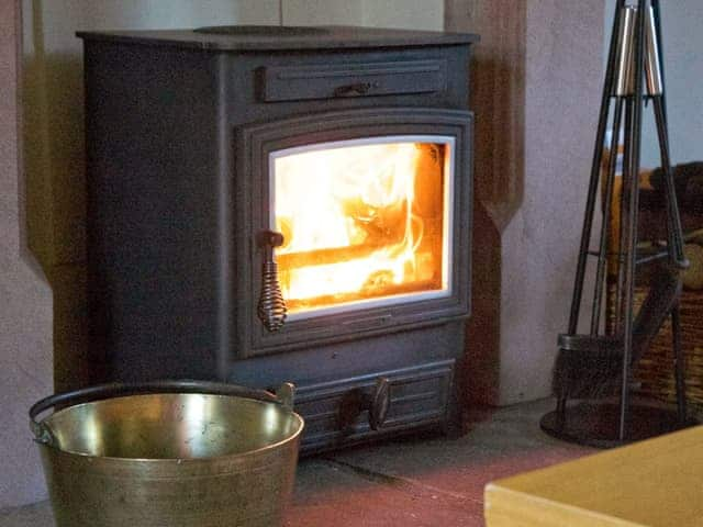 Warming wood-burning fire | Stable Cottage, Greystoke Gill