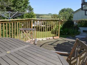 Sunny decked area with outdoor furniture and BBQ | Rockvale 2, 