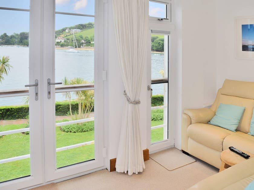 Sitting room with LED multi change lighting and picture window with views across the harbour | Salcombe 16, Salcombe