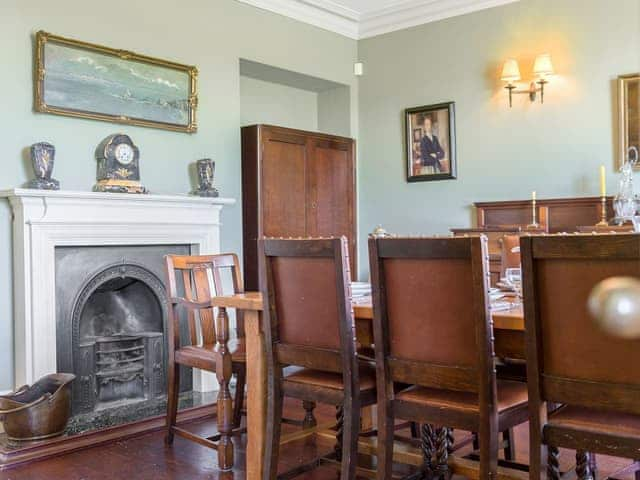 Cosy dining room with open fire | Tilney Hall, Kings Lynn