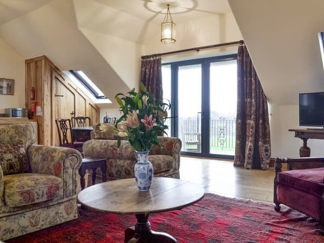 Open-plan room with patio door to balcony | The Granary - High Thorn Farm Cottages, Selside near Kendal
