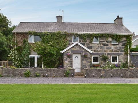 Traditional Welsh cottage situated on a hillside overlooking the Isle of Anglesey | Carreg Y Garth Isaf, Rhiwlas near Bangor