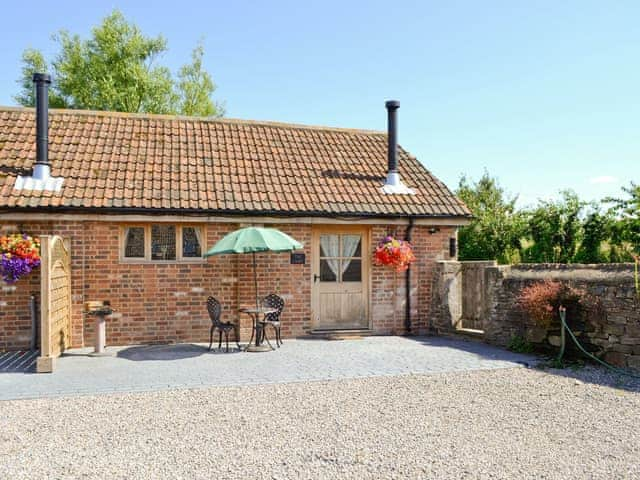 Attractive holiday home with patio and outdoor furniture | The Dairy - Milton End Farm Barns, Arlingham, near Frampton-on-Severn