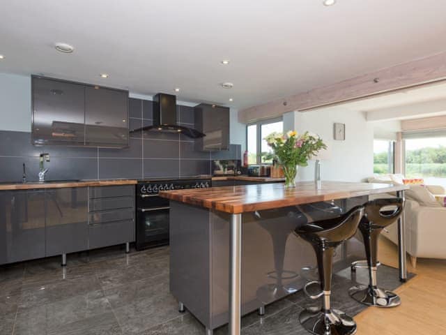 Modern kitchen with &lsquo;island&rsquo; breakfast bar | Silver Dawn, Horning, near Wroxham