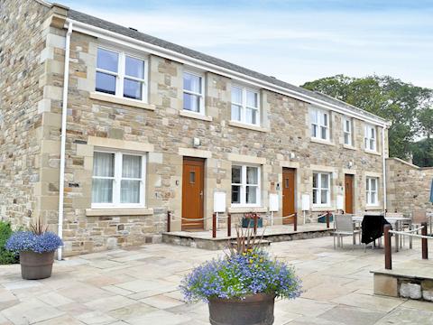 Exterior with shared patio area | Tidal CrestPeartree Apartment 3, Beadnell
