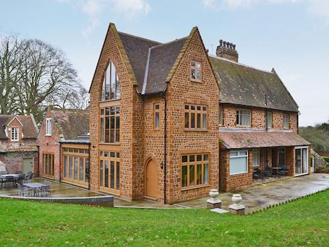 Exterior with shared furnished patio | The Pump House, Old Hunstanton, near Hunstanton