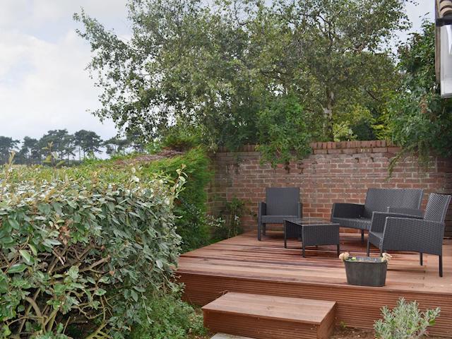 Attractive terraced decking with comfortable outdoor seating | The Seashells, Brancaster Staithe, near Hunstanton