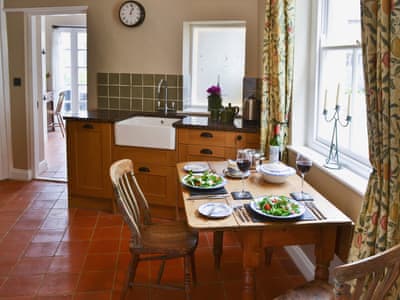 Kitchen diner with range cooker and belfast sink | Pippin Cottage, Holt