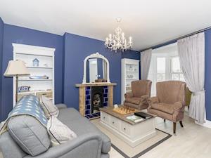 Living room with large windows with view accross Whitby and the harbour. | Frankland House, Whitby
