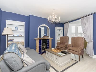 Living room with large windows with view accross Whitby and the harbour. | Frankland House, Whitby