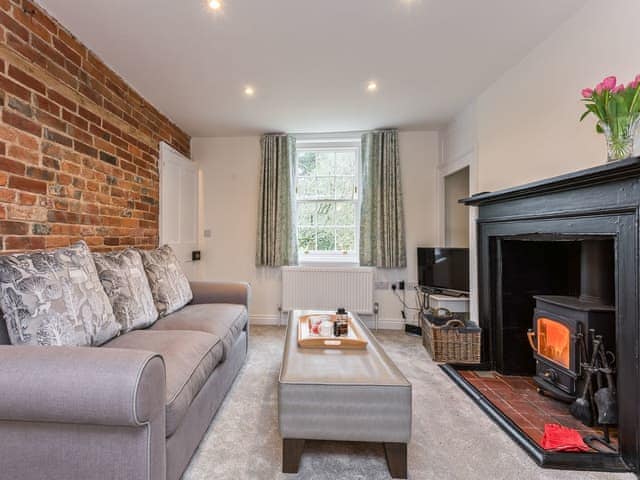 Comfortable living room with wood burning stove | Pond Cottage, Boldre, near Lymington