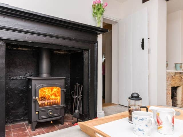 Comfortable living room with wood burning stove | Pond Cottage, Boldre, near Lymington