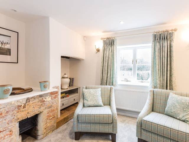 Comfortable living room with wood burning stove | Pond Cottage, Boldre, near Lymington