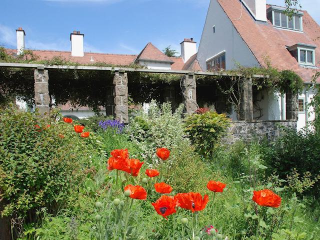 A shady walk and the main house from the verdant gardens | Sandford Country Cottages