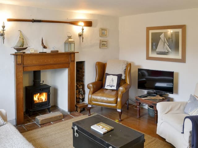 Cosy living room with woodburner | Sea Breeze, Blakeney