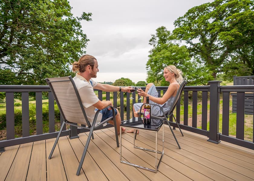 Typical decked area | Symphony 2 Pet - Andrewshayes Orchard Retreat, Axminster
