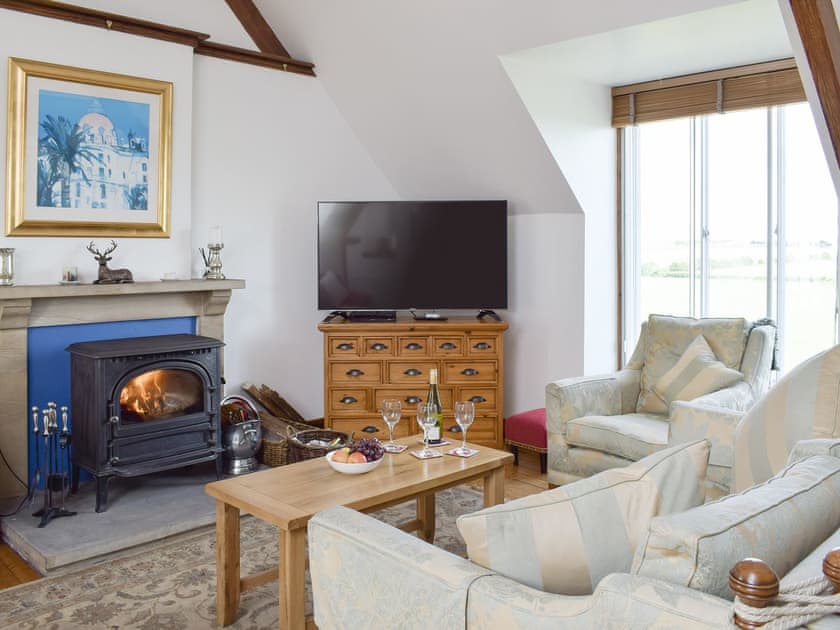 Welcoming living area with wood burner | South House, Lathones, near St Andrews