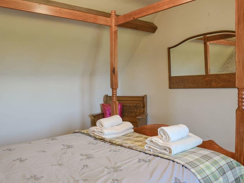 Comfortable four poster bedroom | Y Bwthyn, Llandygai, near Bangor