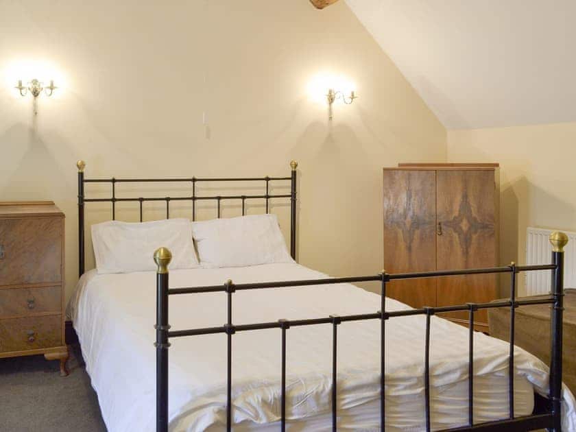 Spacious bedroom with two king size beds | Foremark Threshing Barn - Foremark Cottages, Milton, near Repton