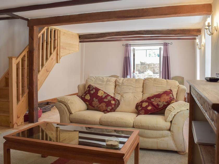 Beamed living room with comfortable furniture | Woodlands, Laugharne, near Pendine