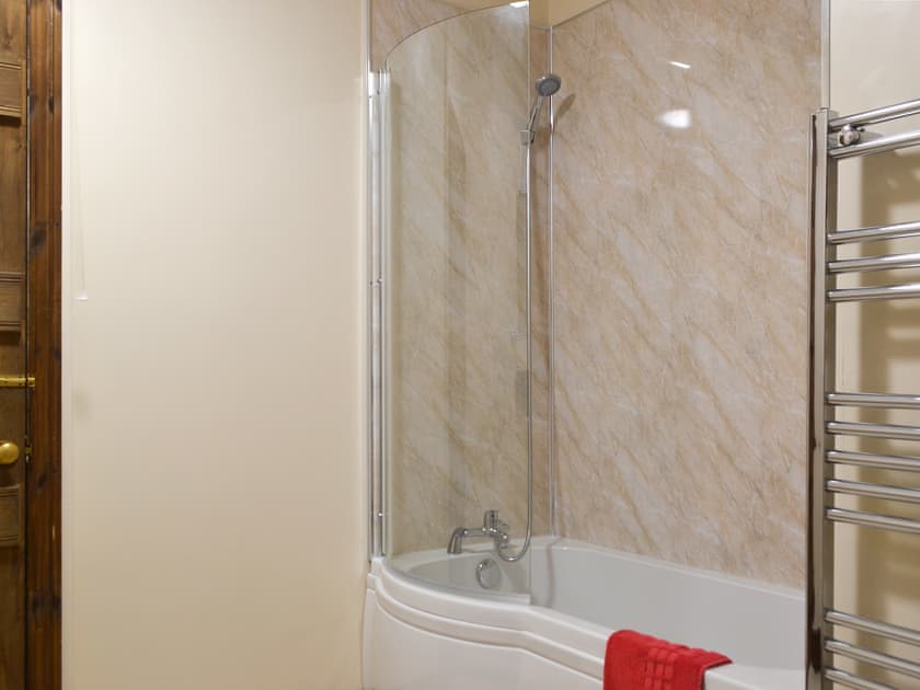 Bathroom with shower over bath | Little Brampton Farmhouse, Clunbury, near Ludlow