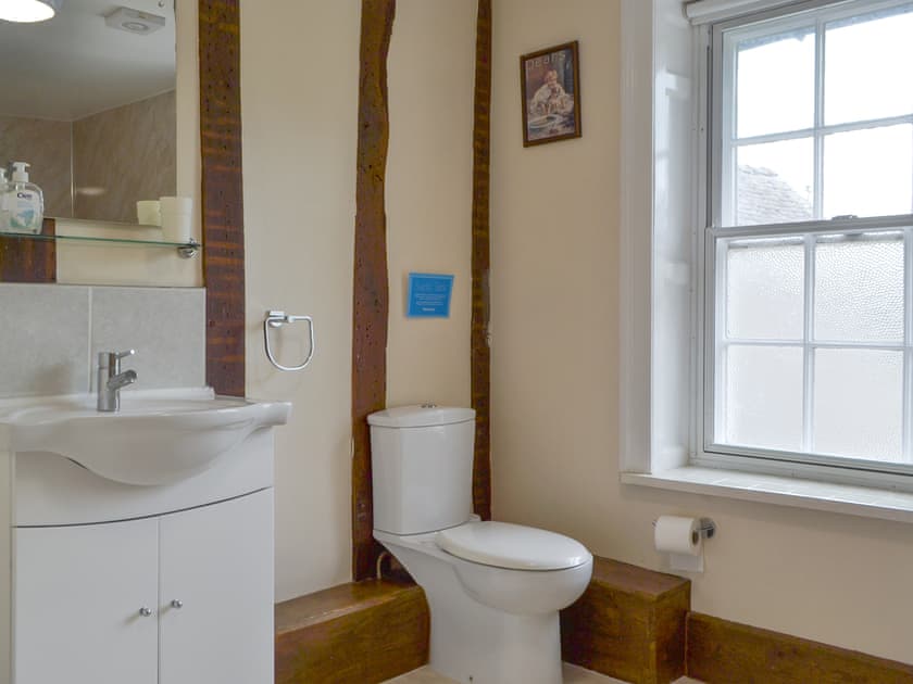 Attractive bathroom with shower over bath | Little Brampton Farmhouse, Clunbury, near Ludlow