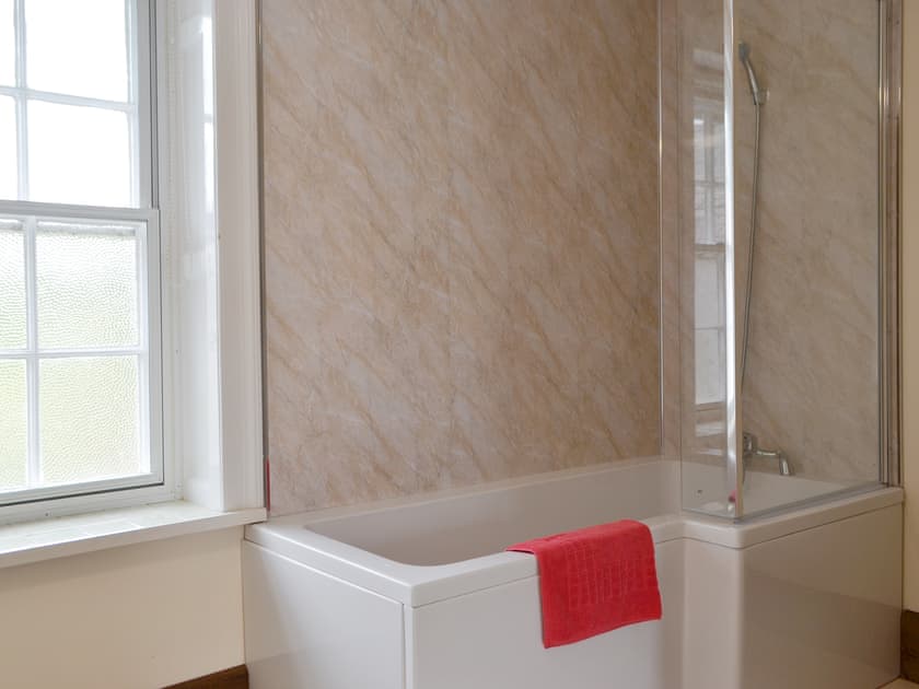 Attractive bathroom with shower over bath | Little Brampton Farmhouse, Clunbury, near Ludlow