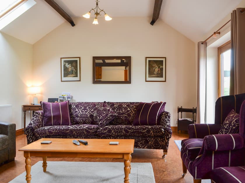 Living/dining room with beams and high ceilings | The Old Sawmill, Clunbury, near Ludlow