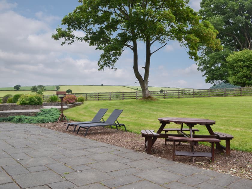 Picnic style seating area with loungers | The Old Sawmill, Clunbury, near Ludlow