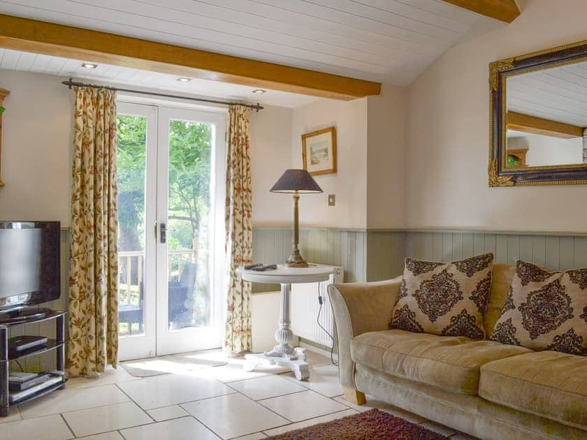 Spacious living area with French doors to balcony | The Dove Cot & Annexe, The Dove Cot - The Dove C, Clappersgate, near Ambleside