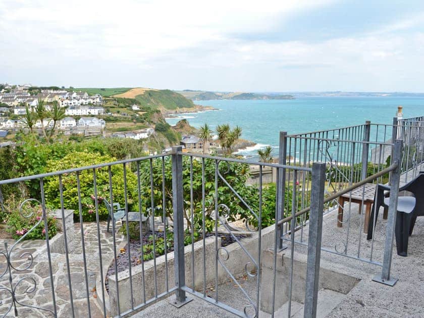 Private patio with incredible coastal views | Morvoren - Polhaun Holiday Apartments, Mevagissey, near St Austell